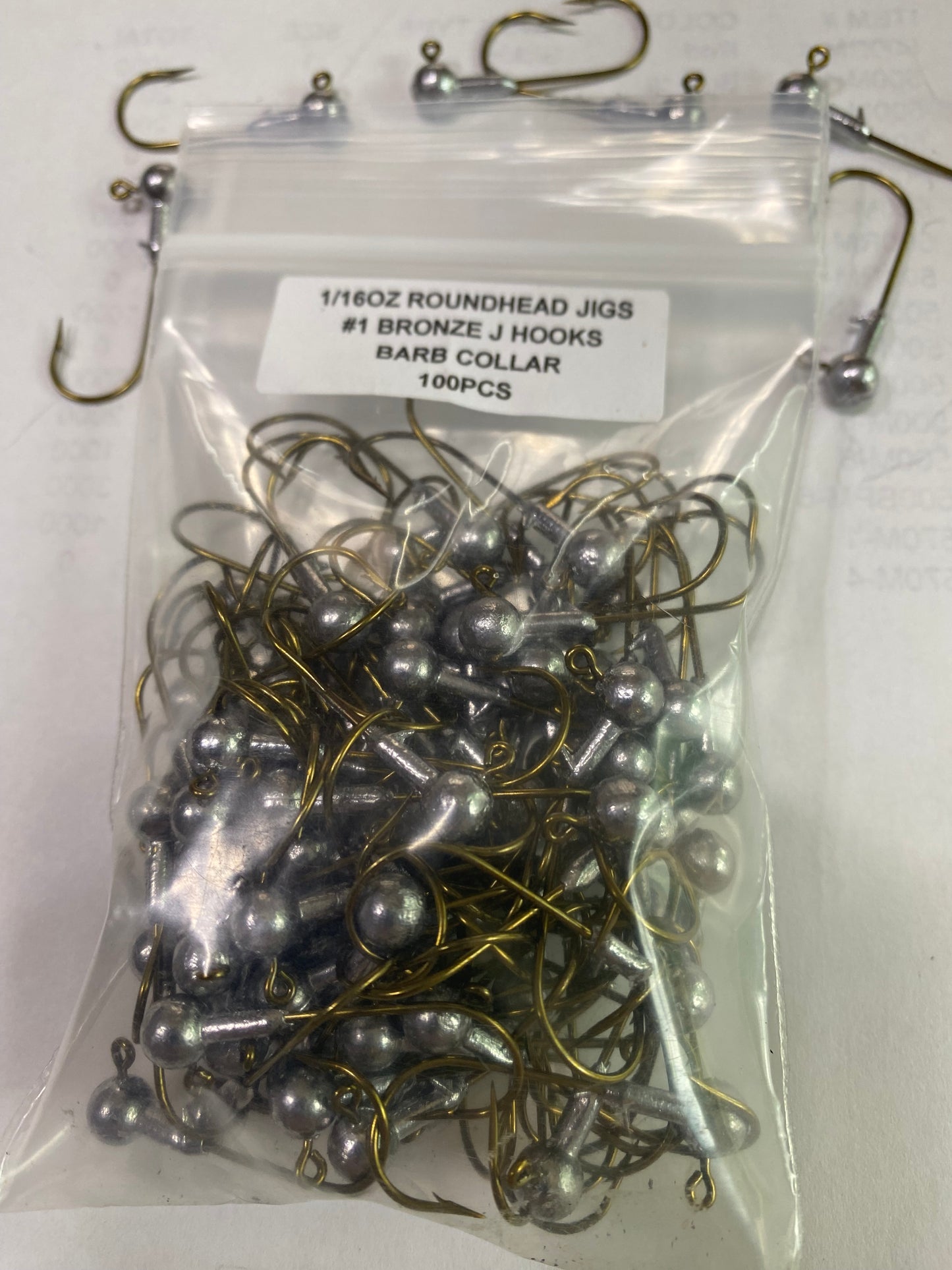1/16oz Roundhead jig barb collar and #1 J bronze hook