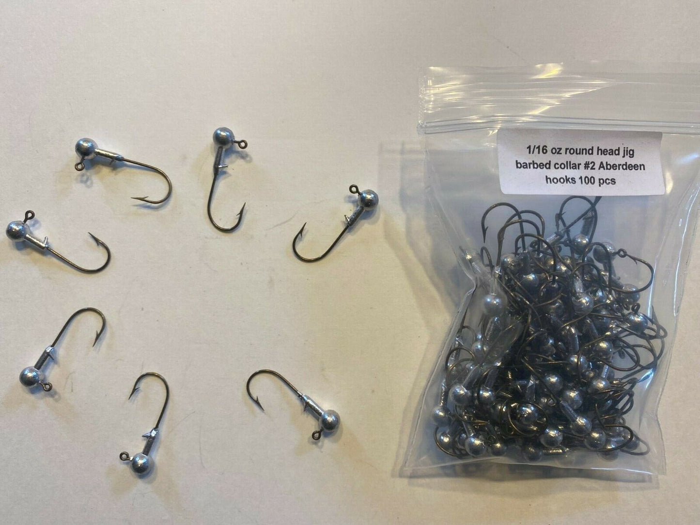 1/16oz Roundhead jig barb collar and #2 J bronze hook