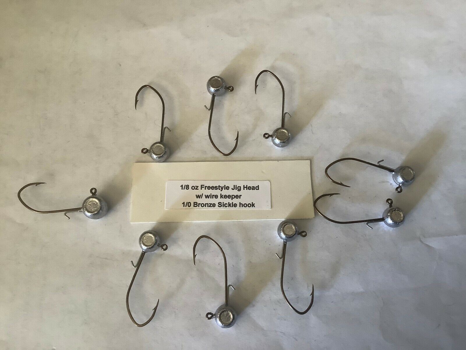 1/8oz with wire keeper freestyle jig heads with a 1/0 bronze sickle hooks 25 pcs 1/8oz with wire keeper freestyle jig heads with a 1/0 bronze sickle hooks 25 pcs