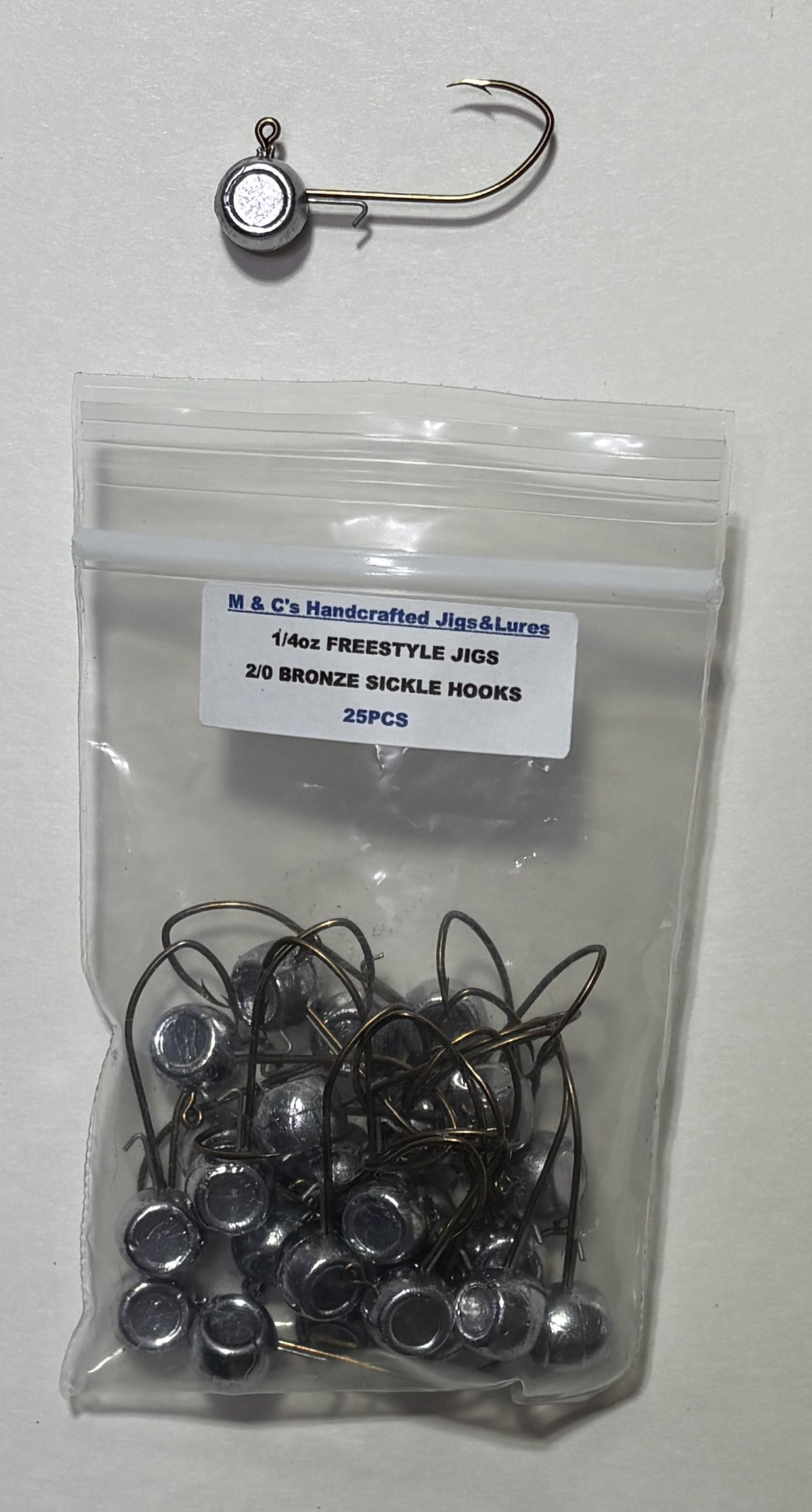1/4oz freestyle jig heads with wire keeper and a 2/0 Bronze sickle 25 pcs