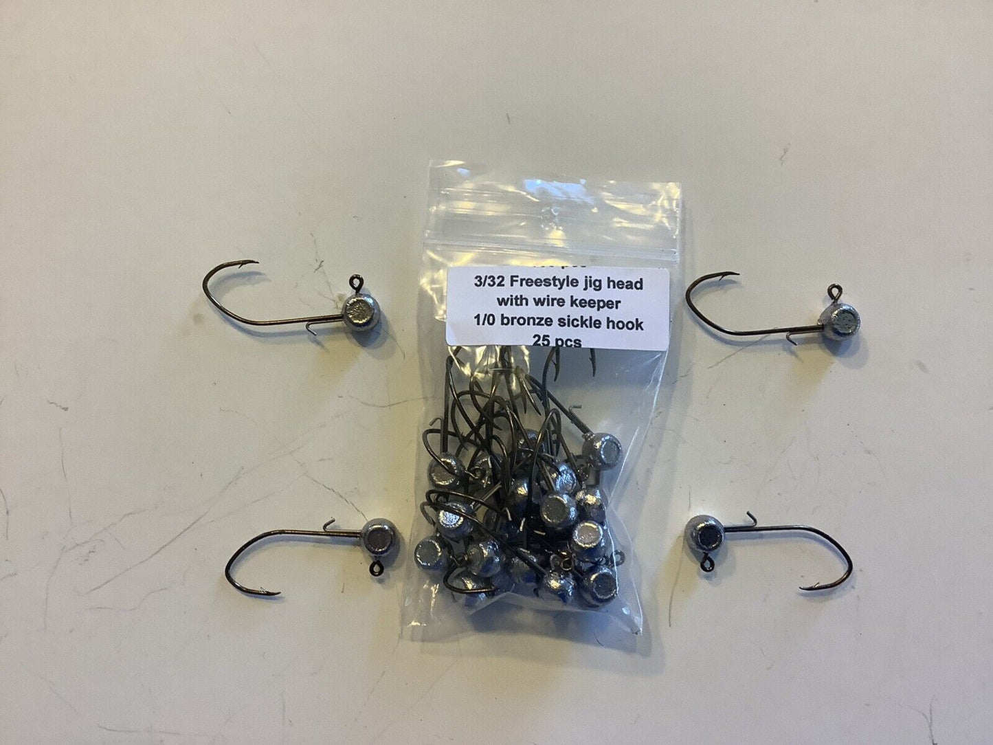 3/32 oz with wire keeper freestyle jig heads with a 1/0 bronze sickle hooks  25 pcs